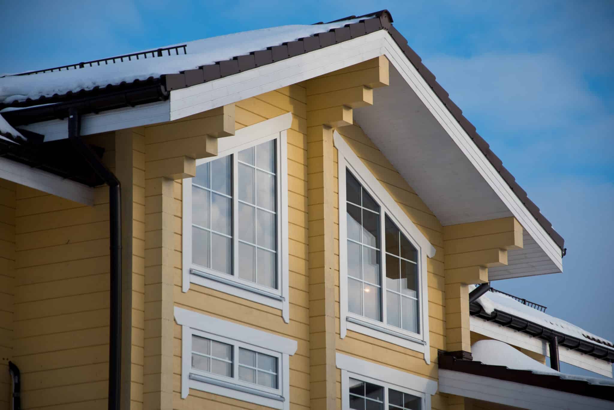 Window,Of,Mansard,Of,The,Wooden,House,Against,The,Sky