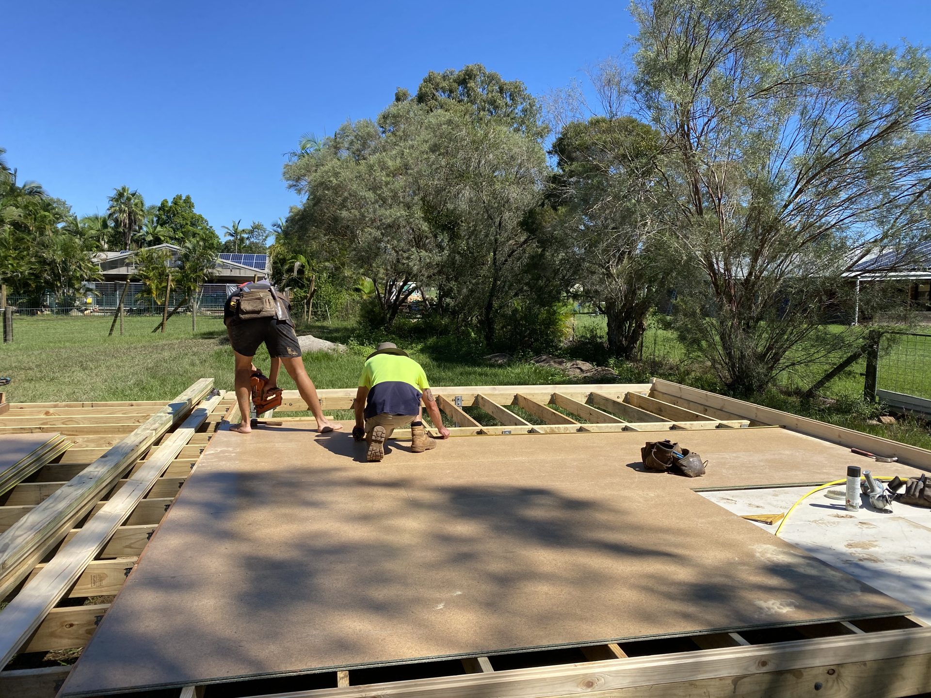Floor deck laid over the bearer frame of a log cabin kit, ready for the wall logs